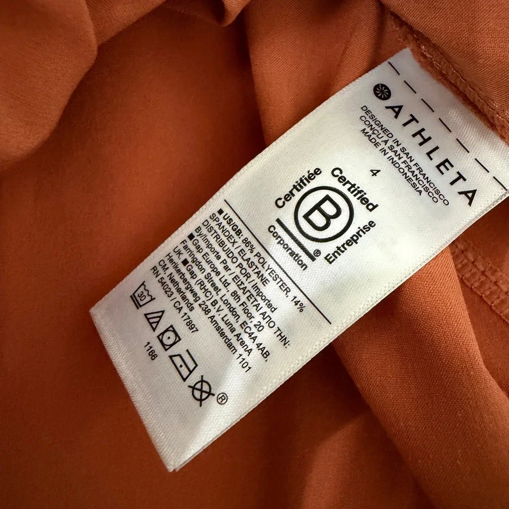 Athleta A-Line Midi Skirt 4 Womens Burnt Orange Zipper Pockets Elastic Earthy